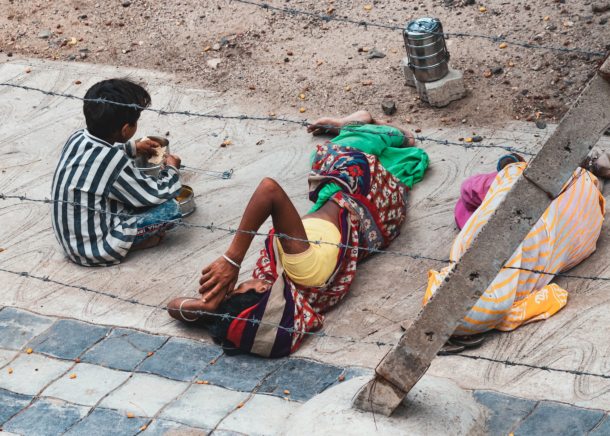 back-view-of-three-children-lying-on-floor-outdoor.jpg