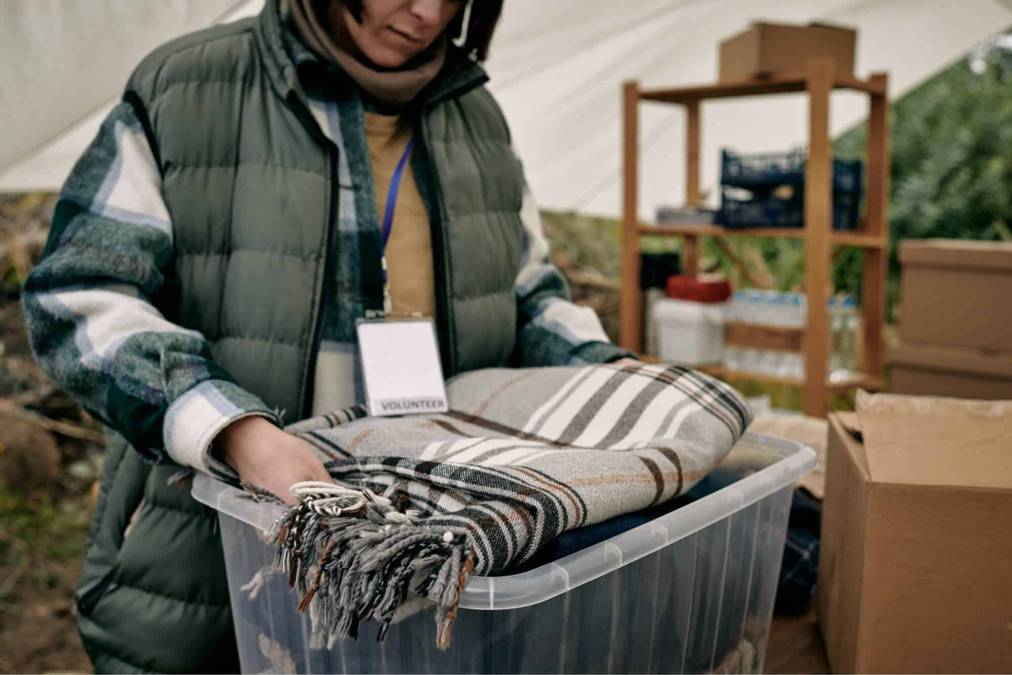 volunteer-preparing-warm-blanket-for-refugees-2021-09-24-02-51-50-utc.jpg
